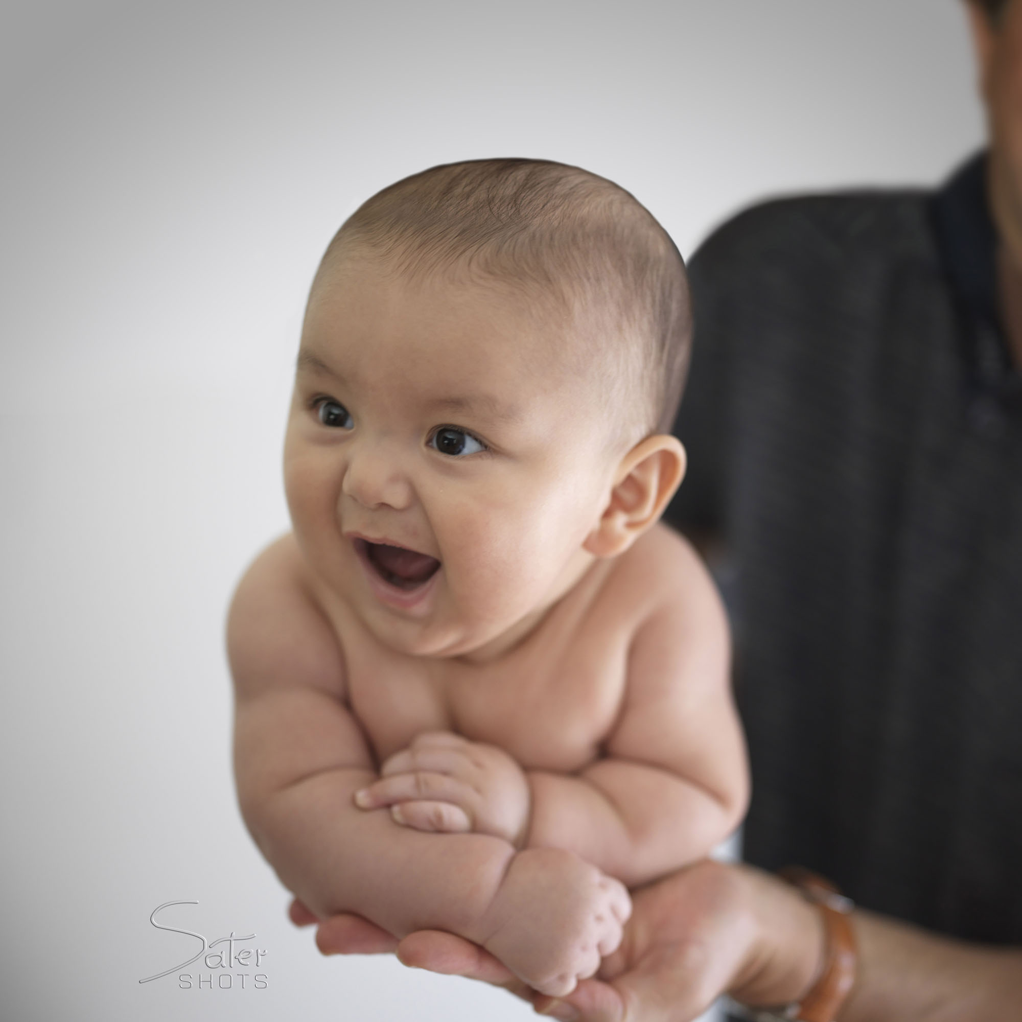 A baby swung by the father